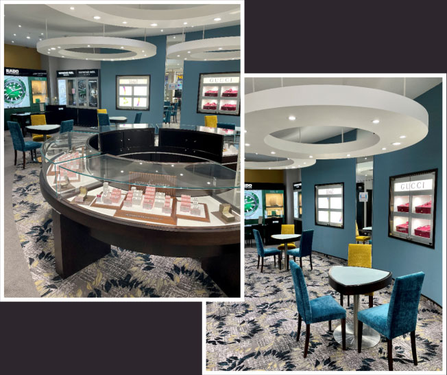 A circular jewellery counter, along with a coupld of small tables with 2 green chairs each